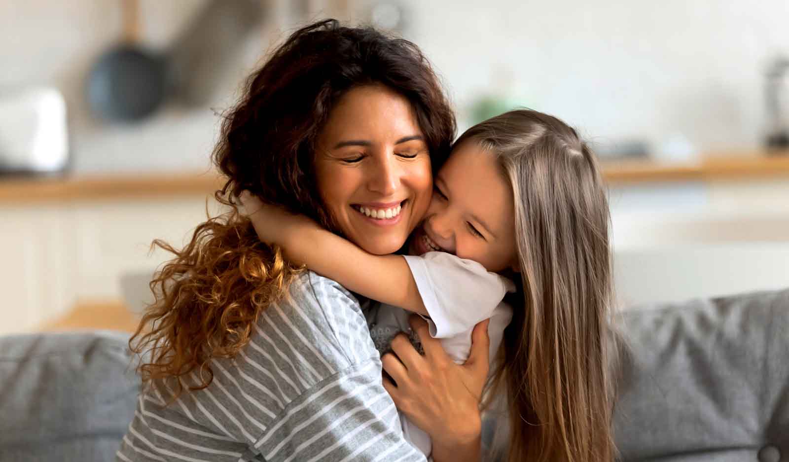 woman hugging daughter