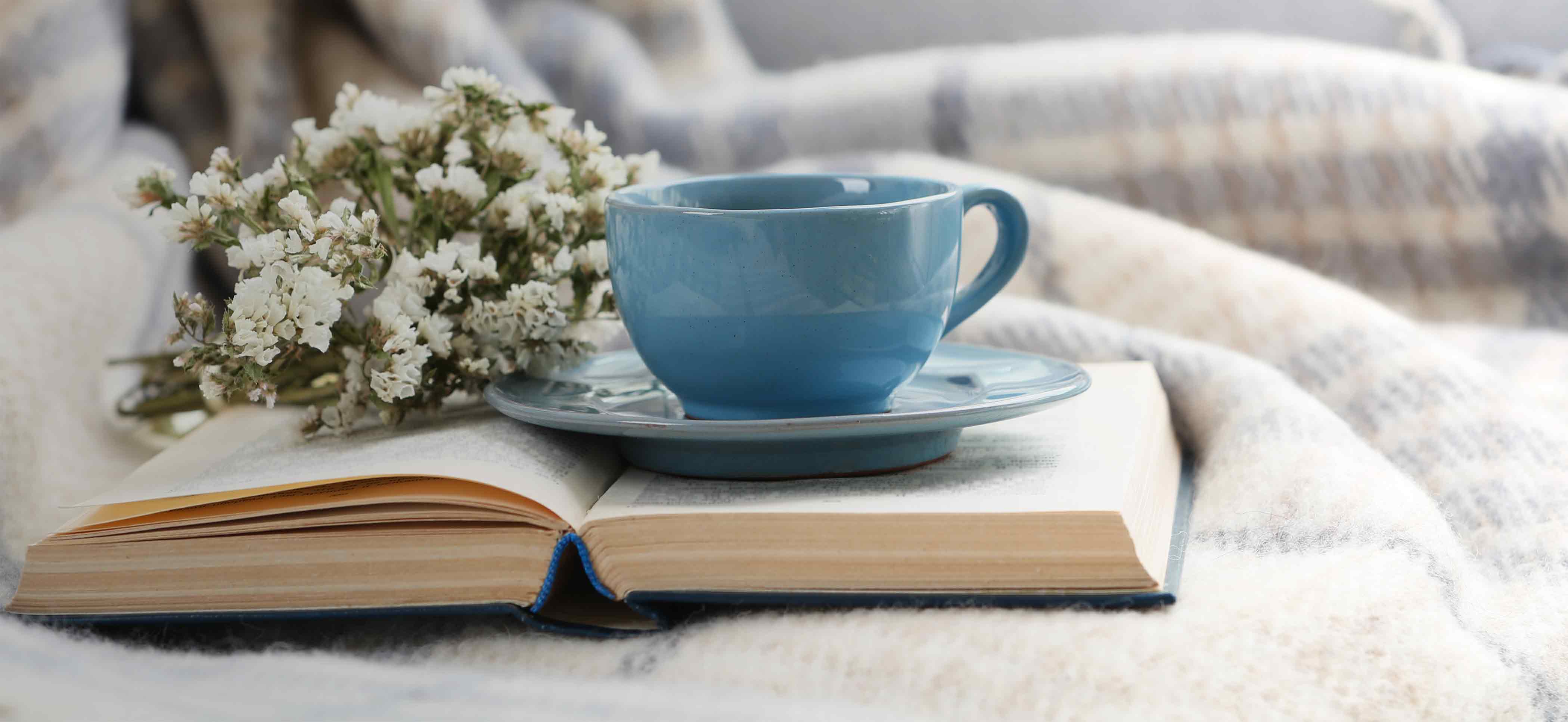 Coffee cup on a book in a relaxing environment