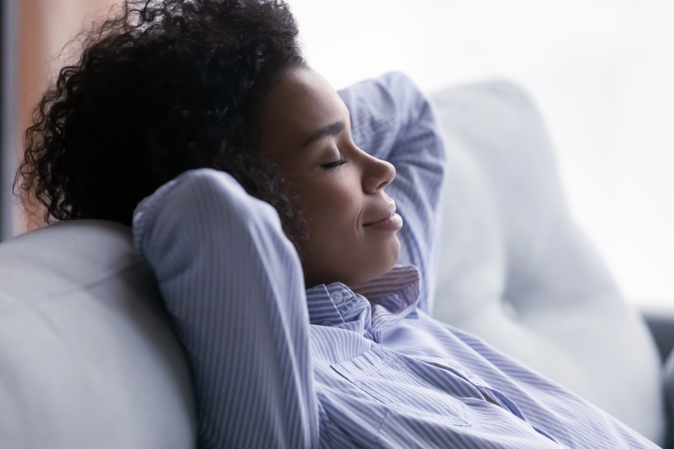 woman relaxing on sofa