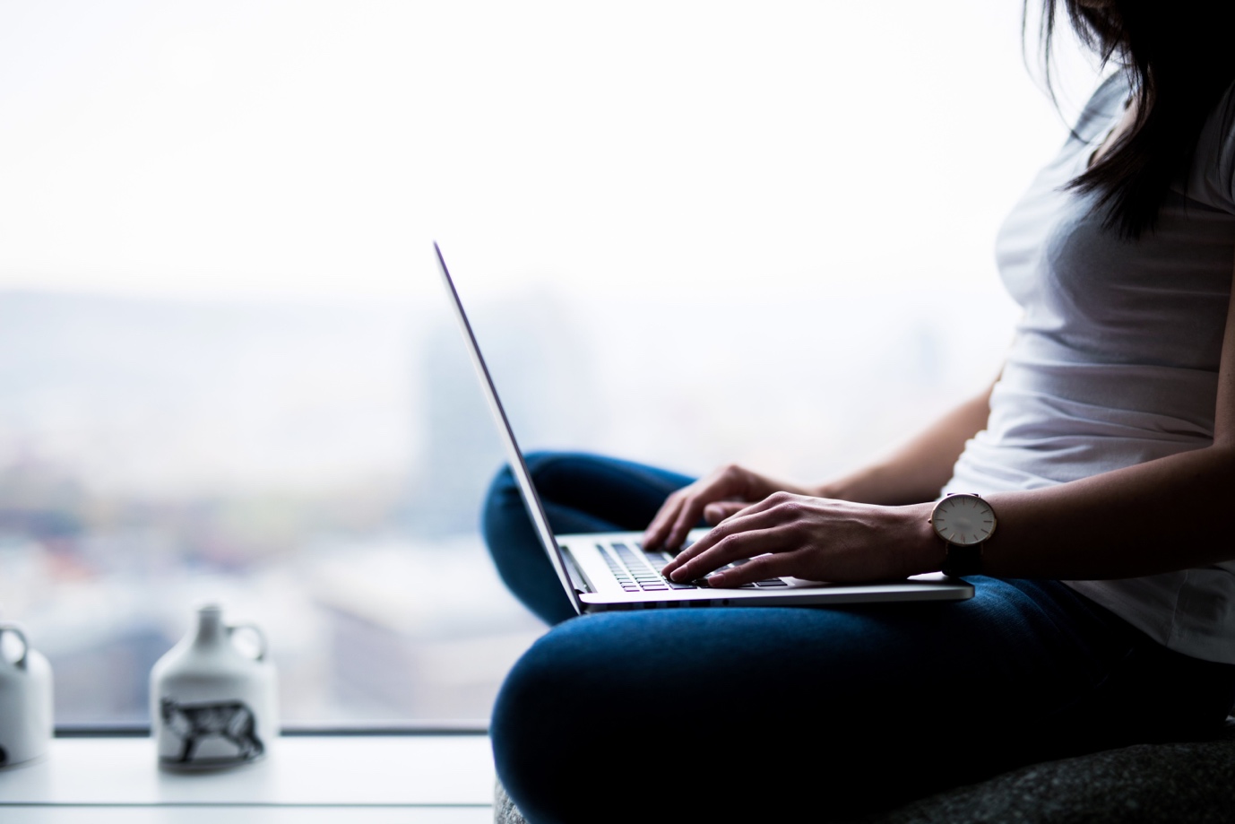 woman typing on laptop