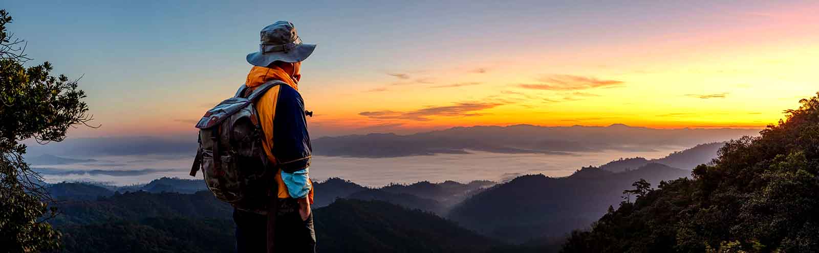 man in front of sunset