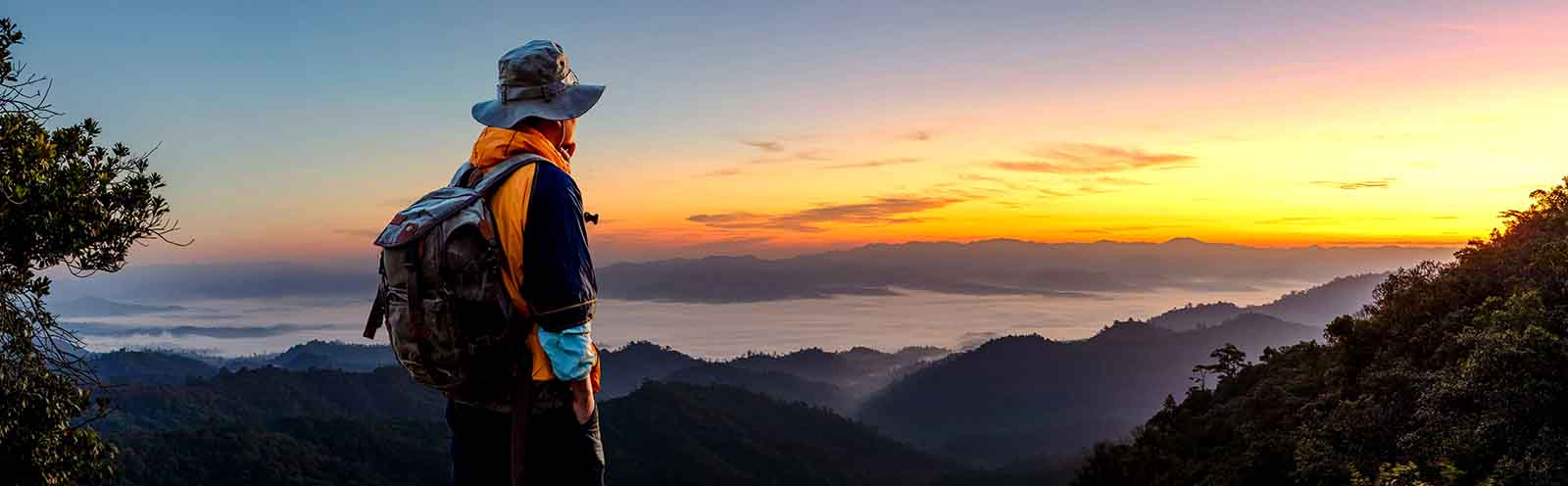 man in front of sunset