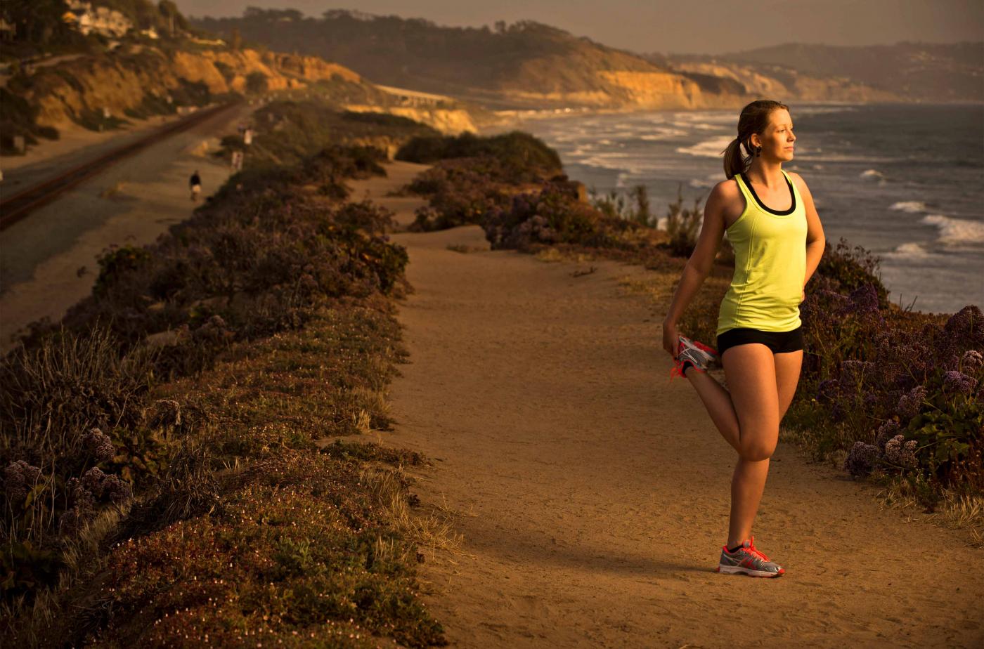 Woman running along ocean